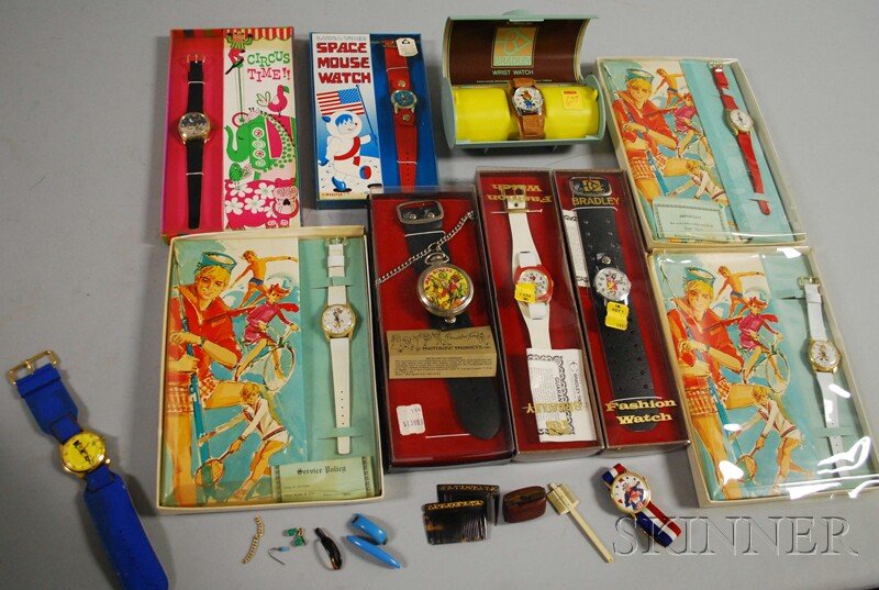 Eleven Vintage Cartoon and Advertising Watches, a : Eleven Vintage Cartoon and Advertising Watches, a Sheraton "Daffy Duck," "Elmer Fudd," and "Cool Cat," a Luna Time "Space Mouse," a "Circus Time," a Photorific "Buck Rogers," a Bradley "Merrie Mouse,"