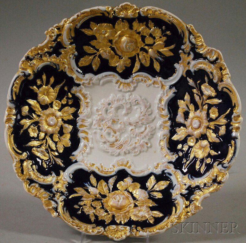 Meissen "New Gold" Porcelain Dish, Germany, 19th c: Meissen "New Gold" Porcelain Dish, Germany, 19th century, with four cobalt cartouches to rim each with raised and gilded floral motifs, first quality crossed swords mark to base, dia. 12 1/4 in.