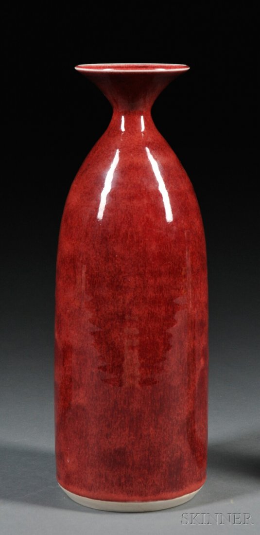 , Brother Thomas Bezanson Tall Vase, Art pottery,: Brother Thomas Bezanson Tall Vase Art pottery Weston, Vermont Wide fluted rim with narrow neck on tall cylindrical body in oxblood glaze with white at edge of rim, inscribed Benedictine Monks Weston V