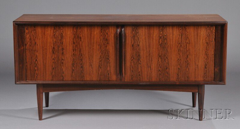 , Mid-Century Modern Danish Credenza, Rosewood ven: Mid-Century Modern Danish Credenza Rosewood veneers Denmark Rectangular top over three compartments with two sliding doors interior fitted with center drawers, raised on rectilinear base frame on four