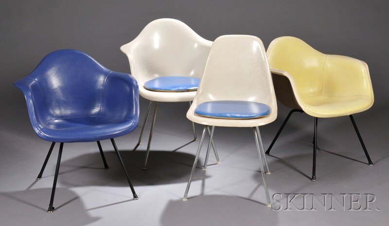, Four Eames Chairs, Fiberglass and metal, Two arm: Four Eames Chairs Fiberglass and metal United States, mid-20th century Two armchairs, one with yellow cover, the other blue, molded shell seat with black legs, unmarked; a fiberglass armchair with Her