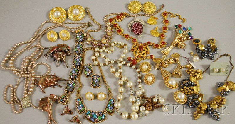 Small Group of Mostly Signed Costume Jewelry, broo: Small Group of Mostly Signed Costume Jewelry, brooches, earclips, necklaces, and faux pearls, some sets, including a Trifari paste and rhinestone raspberry brooch, a group of bullfighting jewelry, a p