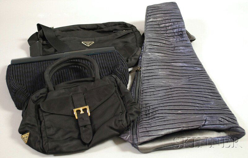 Four Designer Bags, including two Prada black nylo: Four Designer Bags, including two Prada black nylon purses, a woven clutch, and an iridescent blue, pleated shoulder bag by Armani.