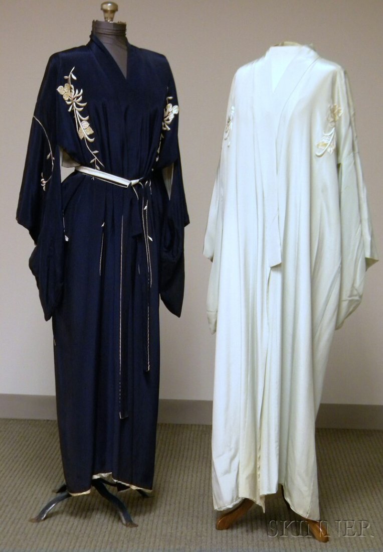 Two Japanese Silk Kimonos, both with embroidery, o: Two Japanese Silk Kimonos, both with embroidery, one navy, the other pale blue, (some staining, discoloration, holes).