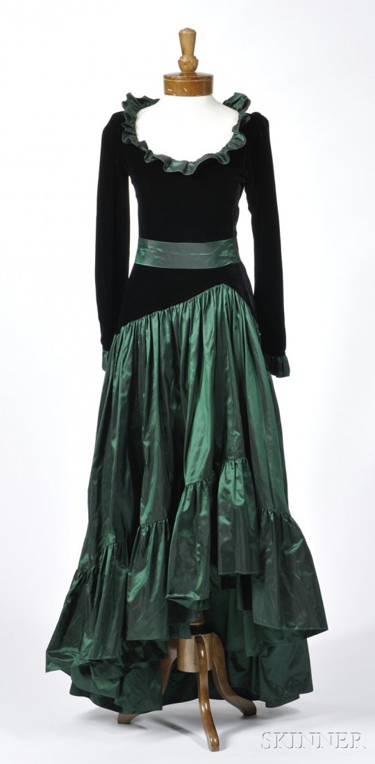 Yves Saint Laurent Evening Dress, black velvet top: Yves Saint Laurent Evening Dress, black velvet top with scoop neck, iridescent green silk ruffled skirt, asymmetrical waist and uneven hemline, with ruffle at collar and wrists, labeled "Saint Laurent