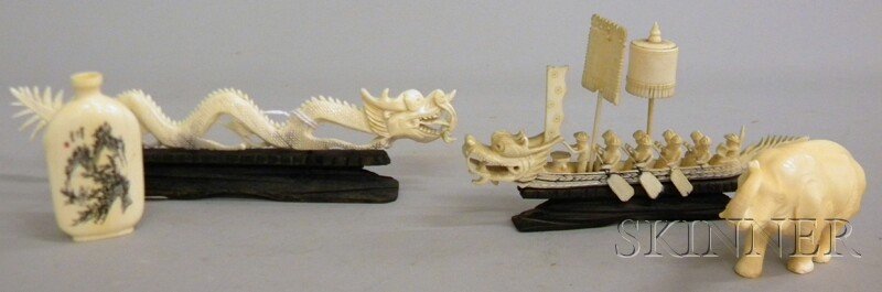 Four Small Chinese Ivory Carvings, an elephant, a: Four Small Chinese Ivory Carvings, an elephant, a snuff bottle, dragon figure, and a boat model with figures, dragon lg. 8 1/4 in.