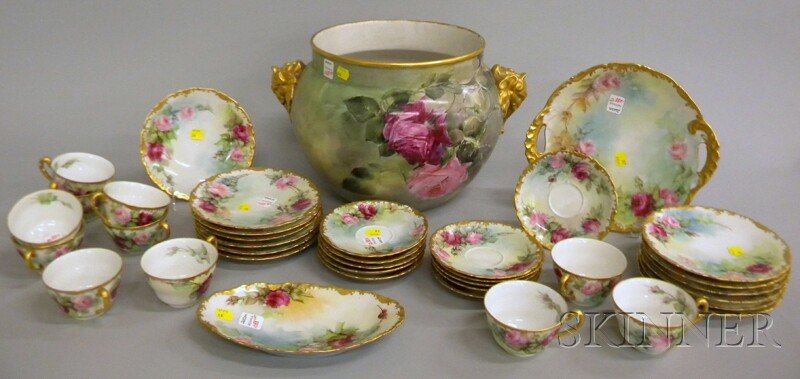 Thirty-seven Pieces of Limoges Gilt and Hand-pain: Thirty-seven Pieces of Limoges Gilt and Hand-painted T. & V. Porcelain Rose-decorated Tableware and a J.P. Jardiniere, including eleven cups and saucers, a pastry dish, and a small oval tray, a set of
