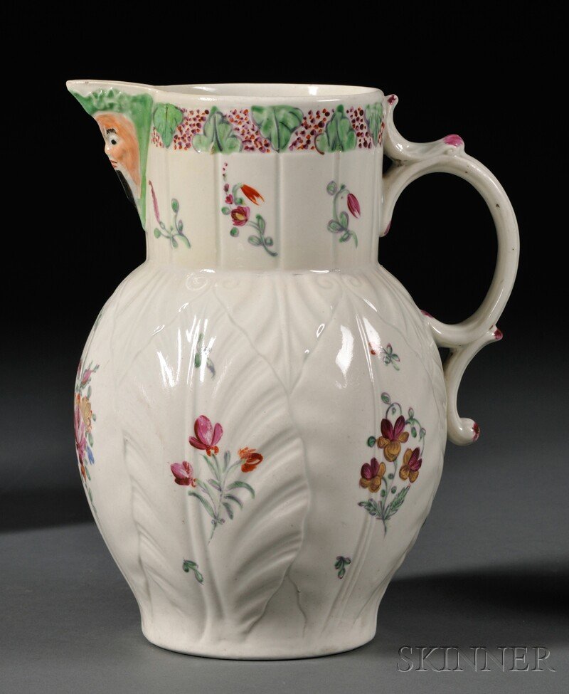 Worcester Porcelain Cabbage Leaf and Mask Jug, Engla: Worcester Porcelain Cabbage Leaf and Mask Jug, England, c. 1785, molded leaf body with polychrome enameled floral sprays, painted workman's mark, ht. 8 3/4 in.