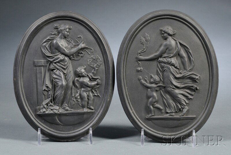 Pair of Wedgwood Self-framed Black Basalt Oval Plaq: Pair of Wedgwood Self-framed Black Basalt Oval Plaques, England, 19th century, classical figures in relief with depictions of Night and Day, impressed marks, lg. 6 1/2 in.
