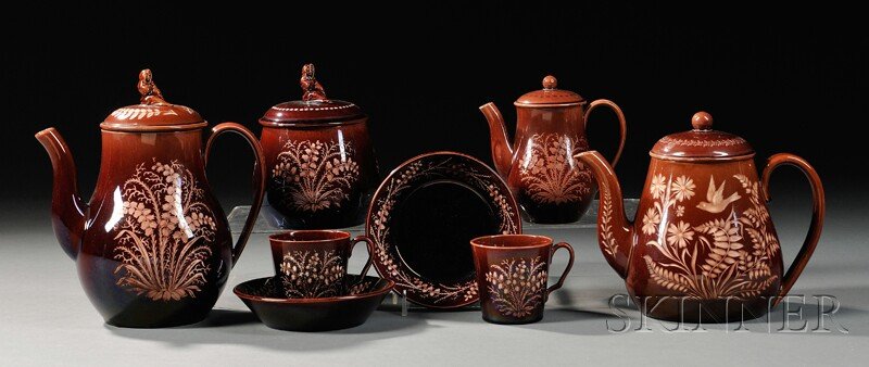 Six Wedgwood Rockingham Glazed Vigornian Tableware: Six Wedgwood Rockingham Glazed Vigornian Tableware Items, England, c. 1877, each wheel-engraved with floral and foliate designs: two teapots and covers, ht. 6 1/4, 8; covered sugar bowl, ht. 5 3/8; sm