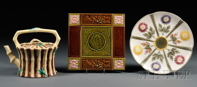 Three Wedgwood Majolica Items, England, second hal: Three Wedgwood Majolica Items, England, second half 19th century, a bamboo-molded tea kettle and cover, ht. 6 5/8; chrysanthemum-decorated low compote, dia. 9; and a tile with portrait center, lg. 8 1