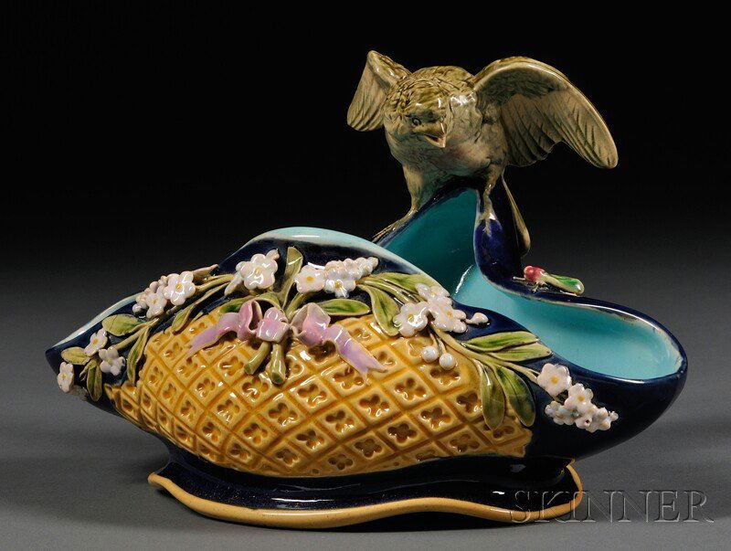 Minton Majolica Shaped Dish with Bird, England, da: Minton Majolica Shaped Dish with Bird, England, date cipher for 1877, modeled as a basket with flowers and insects to front and bird perched to back edge, impressed mark, ht. 5 3/4 in.