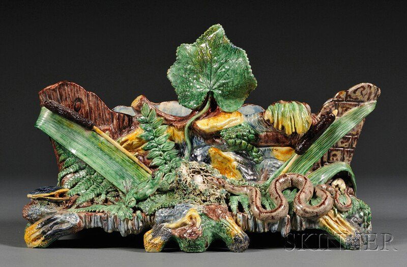 Palissy Majolica Planter, France, late 19th centur: Palissy Majolica Planter, France, late 19th century, modeled as a tree base with a central leaf and overhanging foliage to rim, the front decorated with frogs, clams, a nest of eggs to the center, and