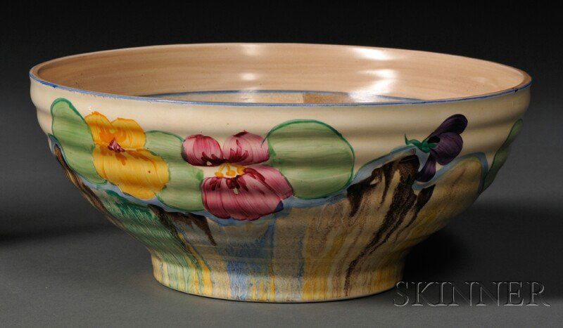Clarice Cliff Bizarre Ware Bowl, England, 20th cen: Clarice Cliff Bizarre Ware Bowl, England, 20th century, Newport Pottery Co., Delecia pattern with pansies and ribbed sides, with backstamp, dia. 9 1/4 in.