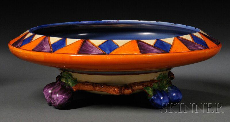 Clarice Cliff Bizarre Ware Bowl, England, 20th cen: Clarice Cliff Bizarre Ware Bowl, England, 20th century, Newport Pottery Co., the saucer-shaped bowl with geometric design to rim and bands of blue, purple, and orange to body, on tripod base formed as