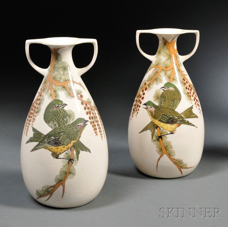 Pair of Amphora Gouda Pottery High Glaze Two-handl: Pair of Amphora Gouda Pottery High Glaze Two-handled Vases, Holland, early 20th century, polychrome enameled, each depicting two green birds on a branch, one with stamped factory mark, the other paint