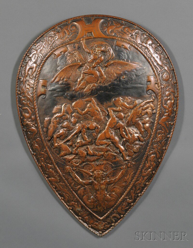 Decorative Iron Shield, 19th century, with bronzed: Decorative Iron Shield, 19th century, with bronzed repousse decoration featuring a battle scene framed by strapwork designs and outer register of men battling monsters, with indistinct stamp on back, 