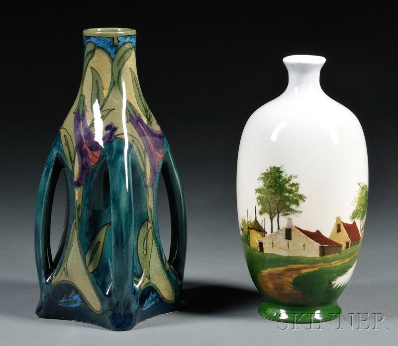 Two Gouda Pottery High Glaze Vases, Holland, early: Two Gouda Pottery High Glaze Vases, Holland, early 20th century, a Zuid Holland four-handled vase decorated in shades of green with purple flowers, with painted PZH factory mark, ht. 9; and a Haga Pur