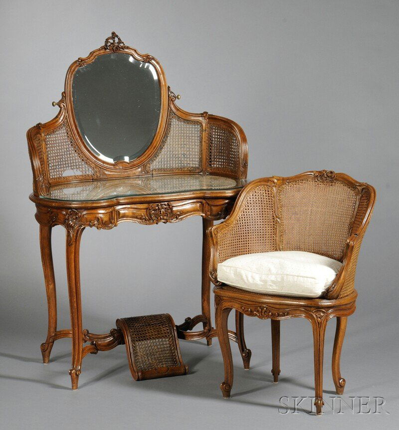 Louis XV-style Oak Vanity and Armchair, 19th cent: Louis XV-style Oak Vanity and Armchair, 19th century, with carved rocaille to frames, the kidney-shaped vanity with shield-form beveled looking glass and caned gallery over silk-inset top, single frie