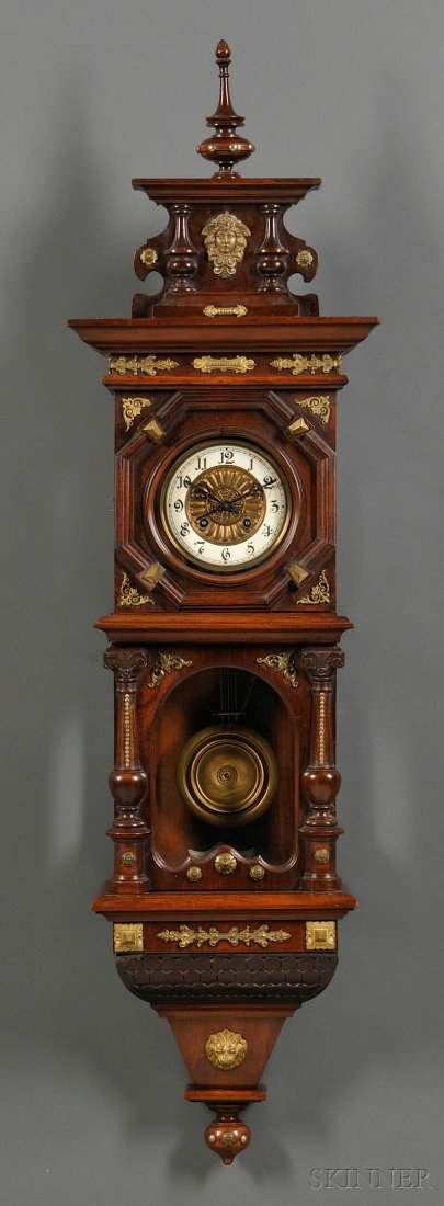 Victorian Wall Clock, 19th century, walnut case wi: Victorian Wall Clock, 19th century, walnut case with turned finial and pendant, decorated with pilasters and gilt mounts, 6-in. diameter dial, with pendulum, ht. 48, wd. 13, dp. 6 3/4 in.