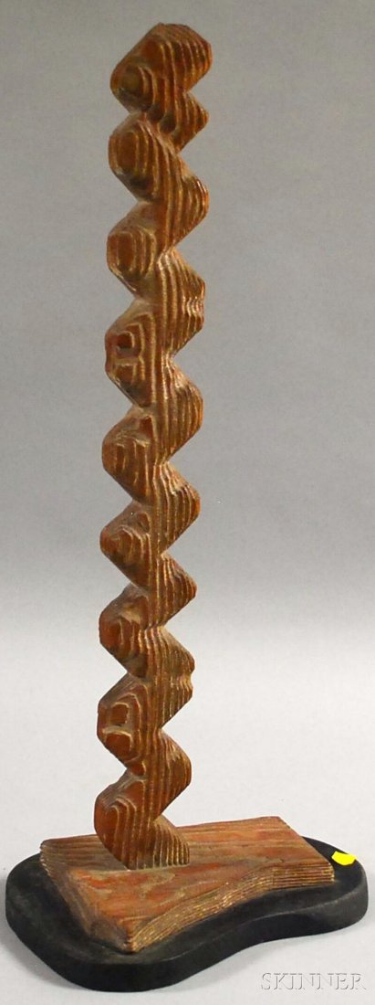 George J. Marinko (American, 1908-1989) Totem-styl: George J. Marinko (American, 1908-1989) Totem-style Sculpture. Estate stamped beneath the plinth. Carved wood, height 23 3/8 in., including integral base, mounted to a black wood plinth. Condition: Du