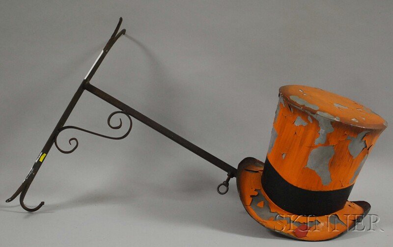 Polychrome-painted Tin Top Hat Trade Sign with Wro: Polychrome-painted Tin Top Hat Trade Sign with Wrought Iron Wall Bracket, 20th century, (paint loss, bends, later paint), hat ht. 8 1/2, bracket lg. 19 1/4 in.