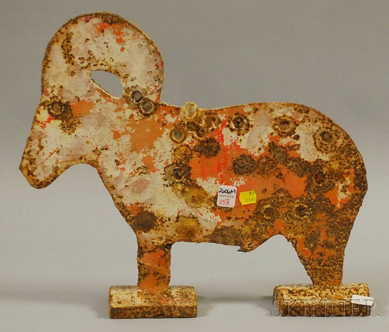 Painted Cut Sheet Iron Ram Shooting Target, overa: Painted Cut Sheet Iron Ram Shooting Target, (old over paint, some corrosion, bullet marks), overall ht. 14 3/4, lg. 17 1/2 in.
