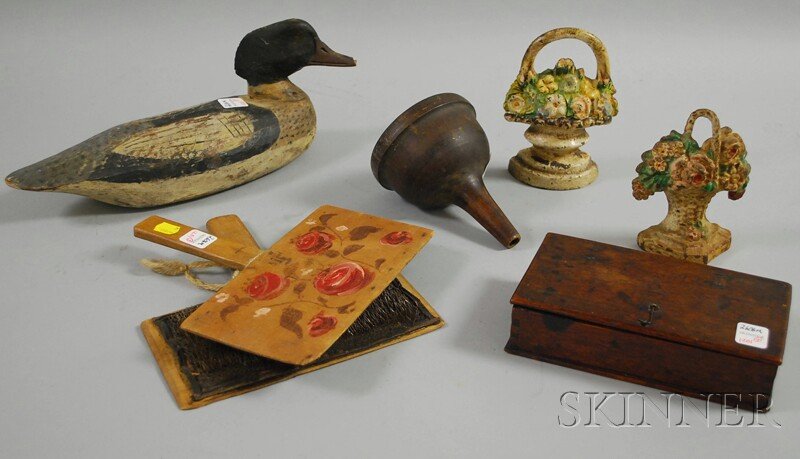 Six Assorted Country and Decorative Items, a carv: Six Assorted Country and Decorative Items, a carved and painted wooden duck decoy, a turned wood funnel, two carding paddles, and two painted cast iron basket of flowers doorstops, (lot does not inclu