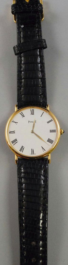 14kt Gold Piaget Wristwatch, mechanical movement,: 14kt Gold Piaget Wristwatch, mechanical movement, cabochon blue stone crown, on lizard band, case no. 9025 279477.