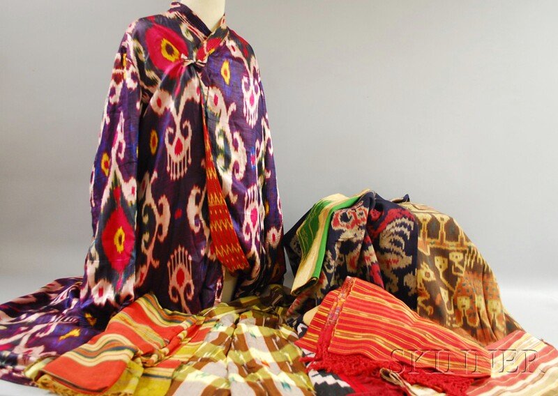 Group of Assorted Ikat and Ikat-style Textiles, in: Group of Assorted Ikat and Ikat-style Textiles, including a silk robe from the Afghan region with varying exterior and interior patterns, fabrics from Indonesia, Africa, and probably South and Central
