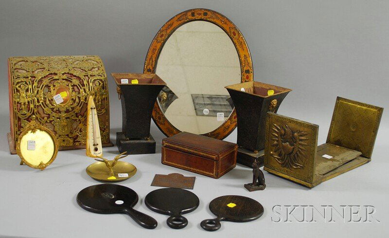 Fourteen Assorted Decorative and Collectible Item: Fourteen Assorted Decorative and Collectible Items, including an ivory tusk desk thermometer, a pair of painted tin vases, three ebony hand mirrors, a bronze Egyptian cat figure, a gilt-tooled leather
