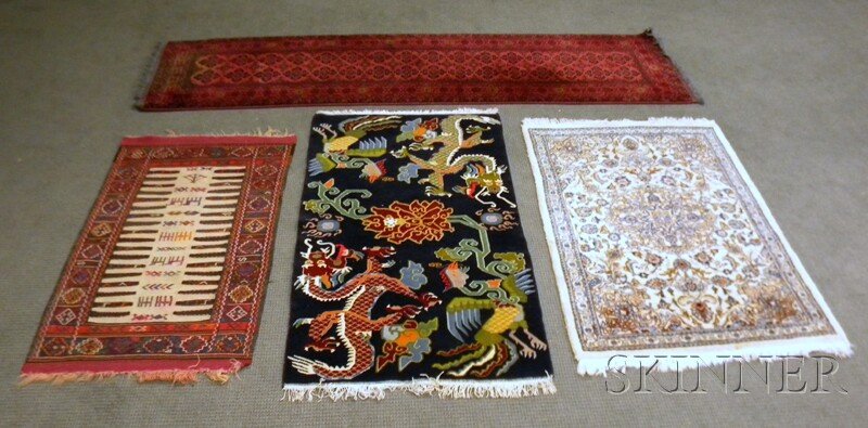 Four Oriental Rugs, contemporary, a Pakistani run: Four Oriental Rugs, contemporary, a Pakistani runner, 9 ft. 6 in. x 2 ft. 9 in., a Tibetan, 5 ft. 8 in. x 3 ft., an Indian, 5 ft. x 3 ft. 4 in., and a flatweave, 4 ft. 10 in. x 2 ft. 9 in.
