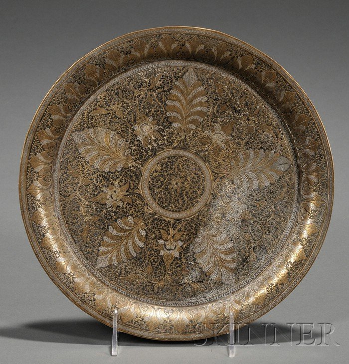 Persian Inlaid Brass Plate, inlaid with zinc and: Persian Inlaid Brass Plate, inlaid with zinc and enamel, the design of stylized leafy meanders, dia. 9 7/8 in.