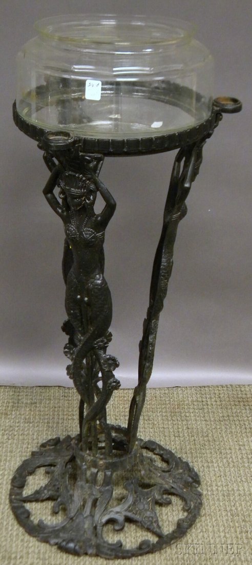 Black-painted The Booth Co. Cast Iron Mermaid Fig: Black-painted The Booth Co. Cast Iron Mermaid Figural Floor Standing Base, Chicago, early 20th century, cast label and "patent pending," with a colorless glass fish bowl, stand ht. 31 1/4, top overall