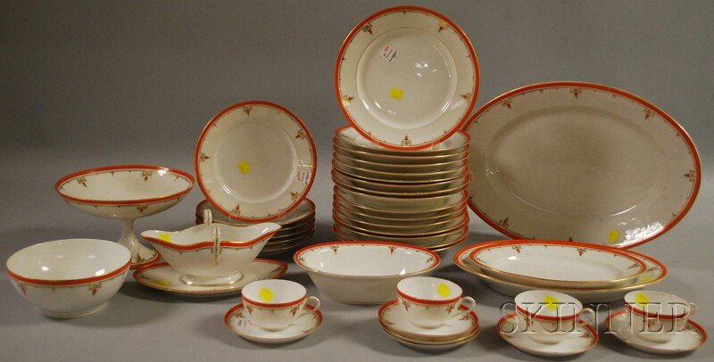 Paris Porcelain Gilt-decorated Orange-rimmed Part: Paris Porcelain Gilt-decorated Orange-rimmed Partial Dinner Service, including sixteen dinner plates, six lunch plates, four cups with six saucers, a gravy boat and undertray, two bowls, three platter