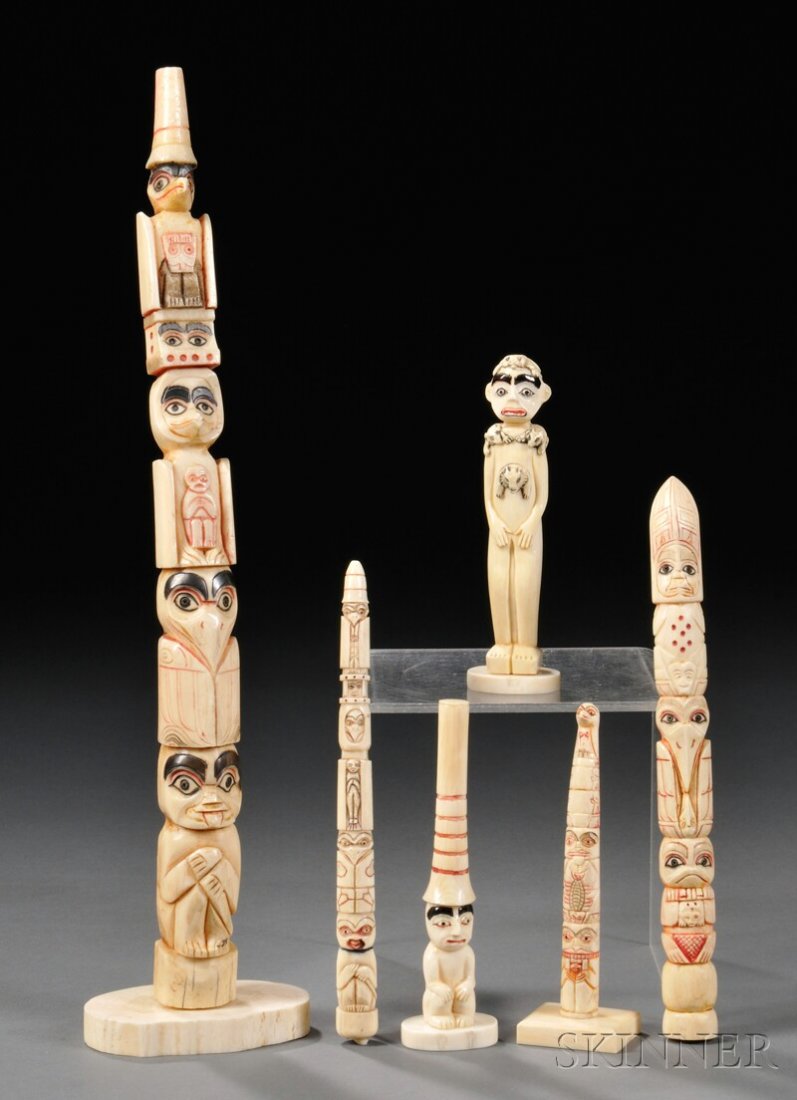 Six Carved Bone Totem Poles, with painted detail,: Six Carved Bone Totem Poles, with painted detail, ht. to 12 in. Provenance: The Bear Totem Store.