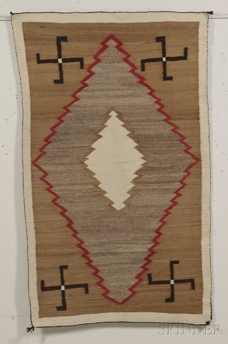 Navajo Textile, natural and synthetic dyed homesp: Navajo Textile, natural and synthetic dyed homespun yarn, with serrate diamond center and whirling log devices, 81 x 37 in. Provenance: Estate of Susan Parrish.