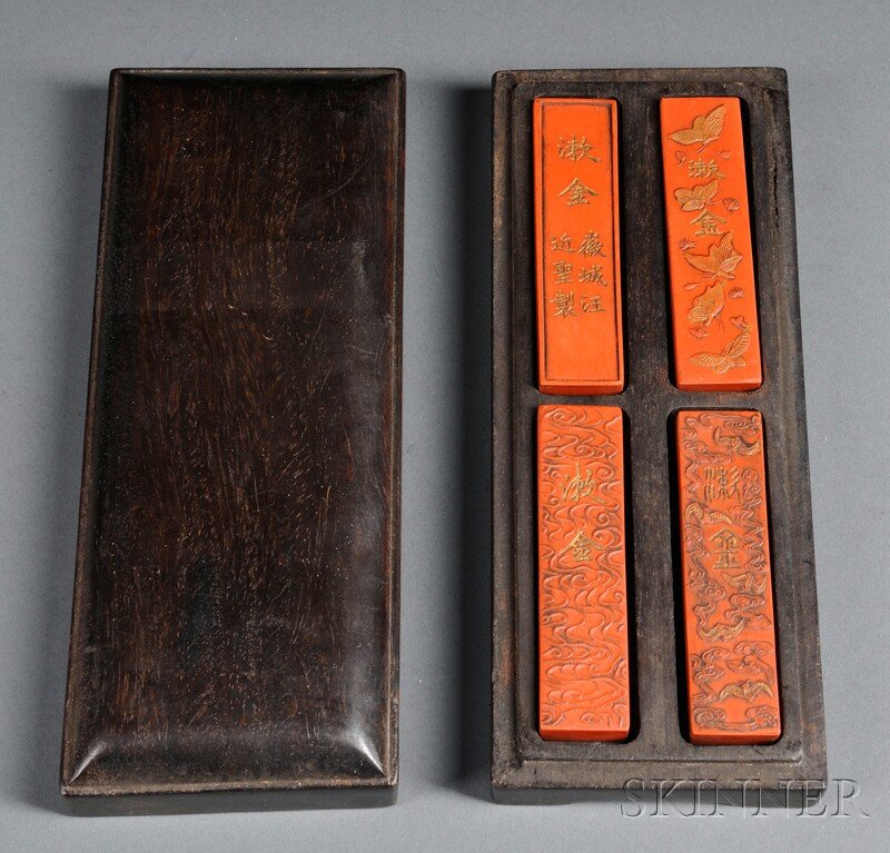 Cinnabar Inksticks in Wood Box, China, 19th centur: Cinnabar Inksticks in Wood Box, China, 19th century, rectangular, each decorated with an auspicious motif: butterflies, dragons, bats, and clouds, with details in gilt, each marked Sou Jin (gold-washe