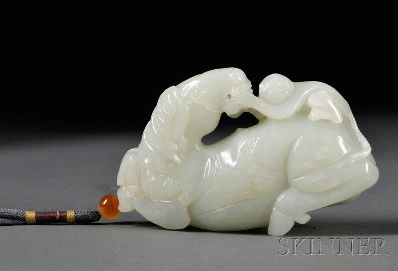 Jade Pendant, China, 20th century, depicting a hor: Jade Pendant, China, 20th century, depicting a horse turning its head back towards a monkey, stone of pale celadon color, lg. 4 in.