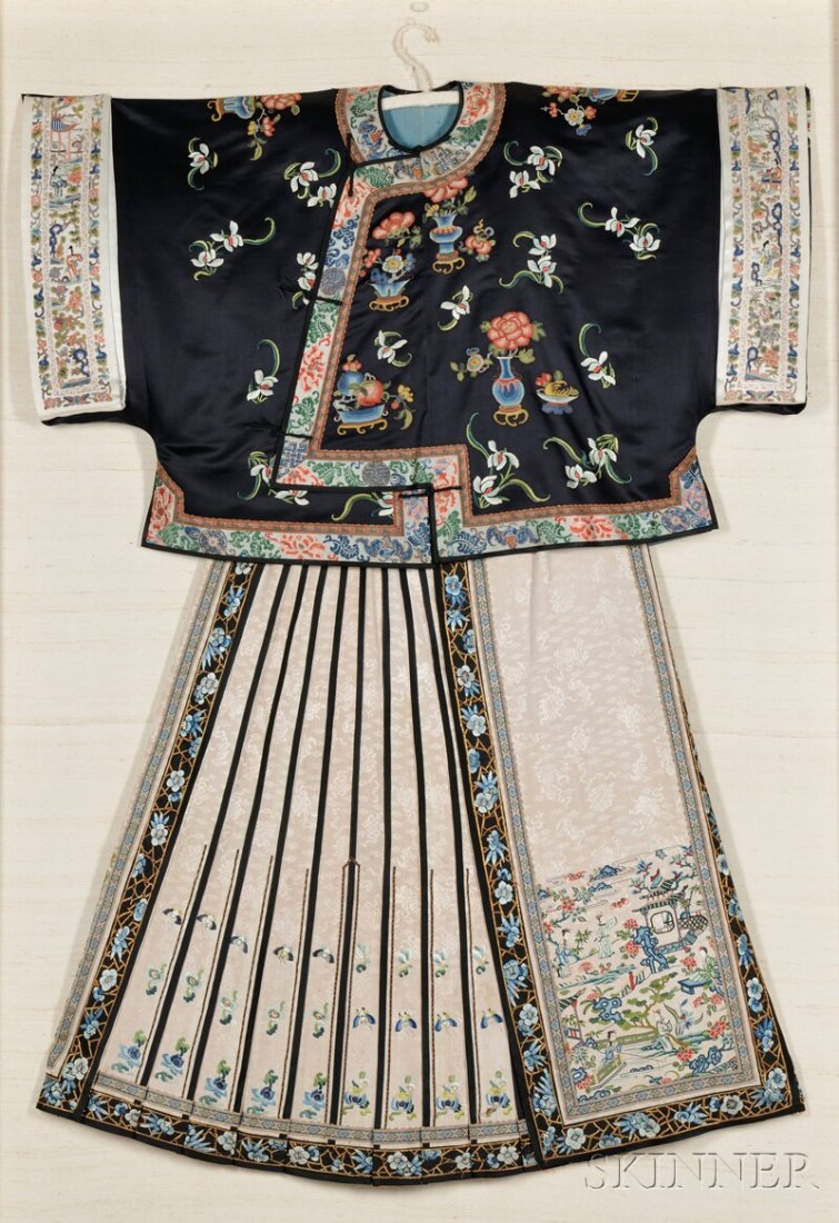 Woman's Short Jacket with Skirt, China, 19th centu: Woman's Short Jacket with Skirt, China, 19th century, jacket of dark blue silk embroidered with vases of peonies and other auspicious fruits and flowers, the cream-colored trim decorated with bats, pe