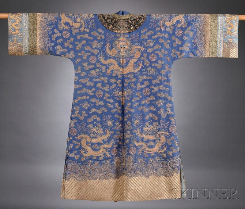 Dragon Robe, China, early 20th century, made into: Dragon Robe, China, early 20th century, made into a surcoat, embroidered with eight five-claw dragons chasing flaming pearls amongst clouds, shou characters, bats, and the Eight Taoist Emblems, all ab