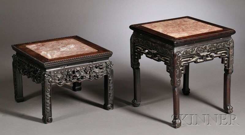 Two Carved Hardwood Export Tables, China, 20th cen: Two Carved Hardwood Export Tables, China, 20th century, the square tops inset with variegated pink marble, one with carved lotus apron with pierced ruyi frieze, resting on four legs with claw-and-ball
