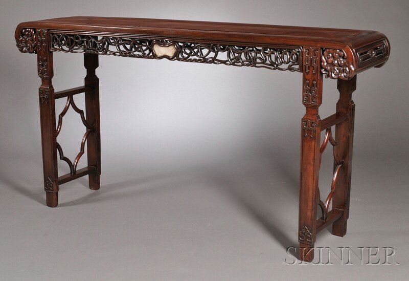Altar Table, China, 20th century, rectangular top: Altar Table, China, 20th century, rectangular top with downswept scrolled ends above a pierced frieze with hardstone inlays, on rectangular-section legs joined on each end by a carved octagonal design