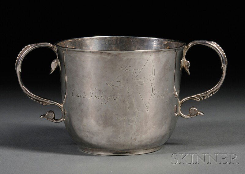 James II Silver Two-handled Cup, London, 1688-89, in: James II Silver Two-handled Cup, London, 1688-89, indistinct maker's mark, with an engraved image of an archer "Charles Dakeyne Capt:Aprill:23:1690" and a heraldic motif to the reverse, ht. 3, wd. 5 3