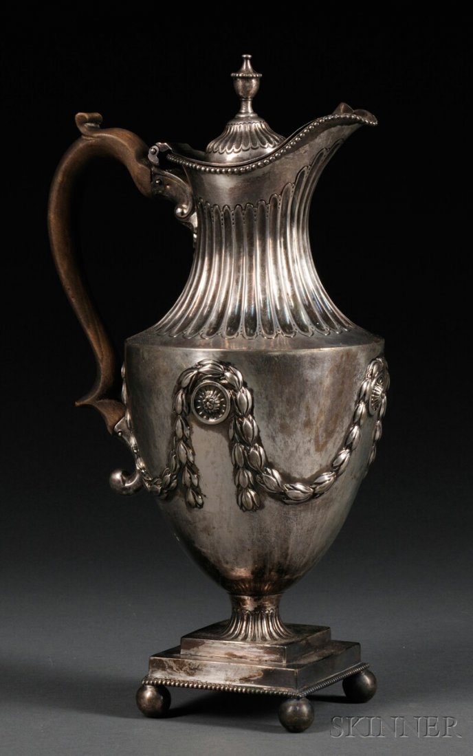 George III Silver Coffeepot, London, 1775, maker's: George III Silver Coffeepot, London, 1775, maker's mark "OP," the hinged and domed lid topped by a finial, over urn-form body with fluted neck, decorated with laurel garlands hung from roundels, on sq