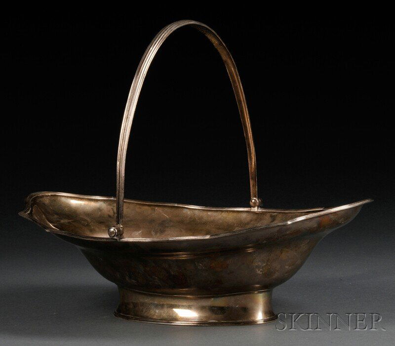 George III Silver Basket with Handle, London, 1792-: George III Silver Basket with Handle, London, 1792-93, maker's mark "JS," possibly for James Smith, oval with reeded handle and rim, on conforming foot, with two armorials to rim, lg. 14 3/4 in., appr
