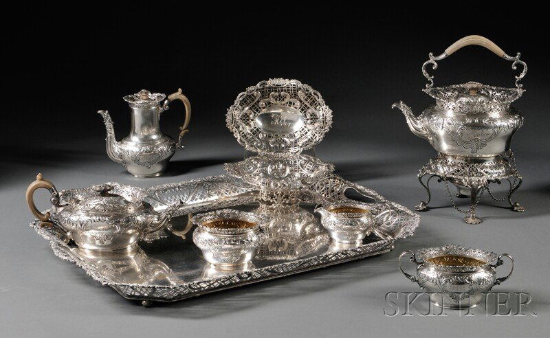 English Tea and Coffee Service Made for Tiffany & C: English Tea and Coffee Service Made for Tiffany & Co., London, 1891-1896, William Comyns, maker, all with pierced rims, floral repousse motifs to the body and monogram "HEC," comprising a kettle on st