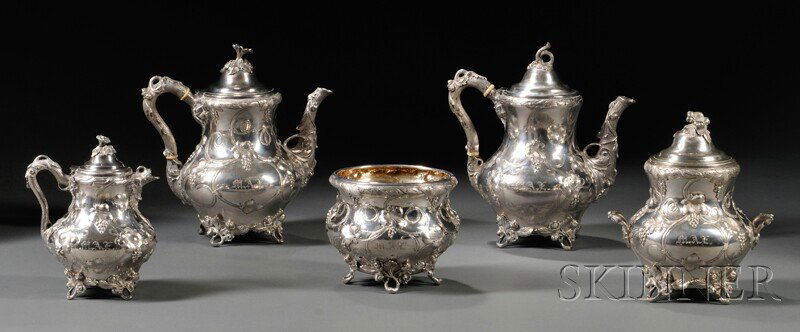 Five-piece Gorham Coin Silver Tea Set, Providence,: Five-piece Gorham Coin Silver Tea Set, Providence, Rhode Island, c. 1860, comprising two teapots each with ivory heat stops and hinged lids topped with foliate finials, a squat creamer with a hinged l