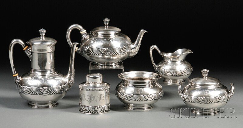 Six-piece Tiffany & Co. Tea and Coffee Service, Ne: Six-piece Tiffany & Co. Tea and Coffee Service, New York, c. 1885, each decorated with registers of repousse waves with scrolled details to handles and spouts, monogrammed, comprising a creamer, cover