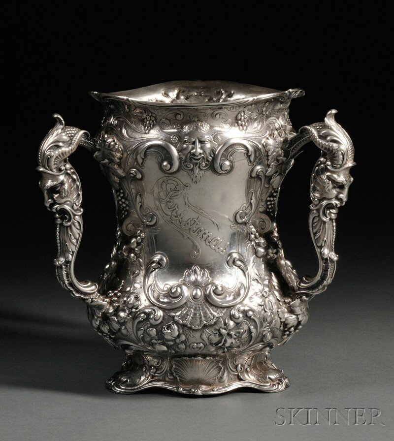 Gorham Sterling Silver Loving Cup, Providence, Rh: Gorham Sterling Silver Loving Cup, Providence, Rhode Island, 1898, retailed by Theodore Starr, with three handles modeled as grotesque masks with ram horns, body with scrolling vines, grapes, and pend